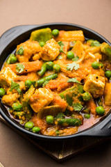 Mix vegetable curry - Indian main course recipe contains Carrots, cauliflower, green peas and beans, baby corn, capsicum and paneer/cottage cheese with traditional masala and curry, selective focus