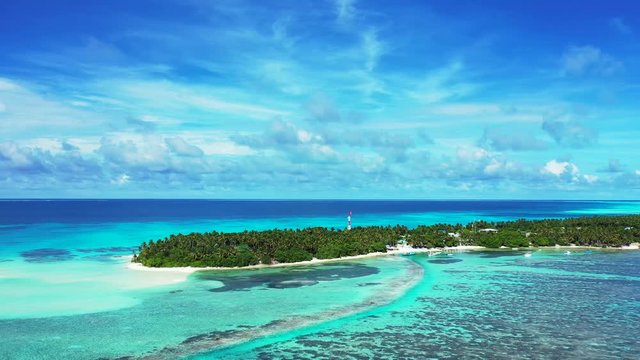 Aerial footage of the Islands of the Cays of the Exumas. The Bahamas. coral reef and uninhabited island with palms