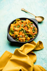 Mix vegetable curry - Indian main course recipe contains Carrots, cauliflower, green peas and beans, baby corn, capsicum and paneer/cottage cheese with traditional masala and curry, selective focus
