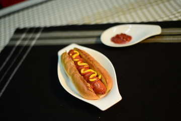 Hot dog with sauce, setup nicely on table ready to serve