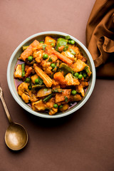 Mix vegetable curry - Indian main course recipe contains Carrots, cauliflower, green peas and beans, baby corn, capsicum and paneer/cottage cheese with traditional masala and curry, selective focus