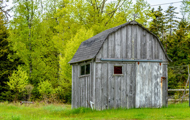 Fototapeta na wymiar Old Weathered Wooden Countryside Barn in New England