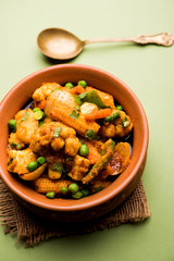 Mix vegetable curry - Indian main course recipe contains Carrots, cauliflower, green peas and beans, baby corn, capsicum and paneer/cottage cheese with traditional masala and curry, selective focus