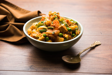 Mix vegetable curry - Indian main course recipe contains Carrots, cauliflower, green peas and beans, baby corn, capsicum and paneer/cottage cheese with traditional masala and curry, selective focus