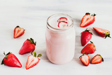 Strawberry milkshake in the glass jar white background