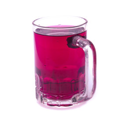 Glass of red grape juice with fruit isolated on white
