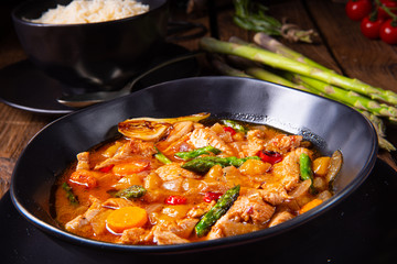 colorful turkey fricassee with asparagus and paprika