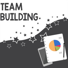 Text sign showing Team Building. Business photo showcasing various types of activities used to enhance social relations Layout Smartphone Off Ballpoint Pen RingBound Notepad Business Pie Chart