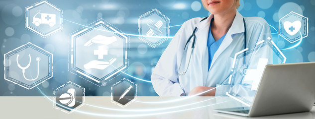 Health Insurance Concept - Doctor in hospital with health insurance related icon graphic interface...