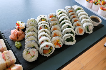 assorted sushi rolls, setup nicely on a table