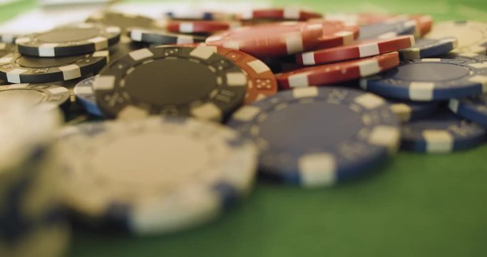 Chips/Checks/Casino Token Dropping On Casino Table - Slow Motion - Close Up