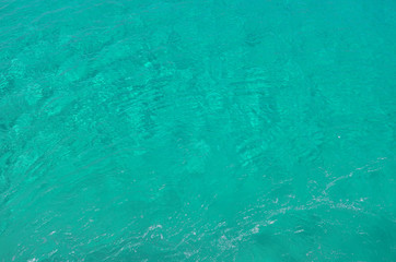 Fototapeta na wymiar Sea transparent clear water. Flowing water surface
