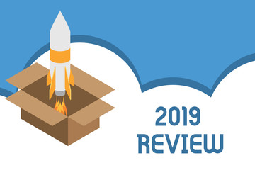 Writing note showing 2019 Review. Business concept for New trends and prospects in tourism or services for 2019 Fire launching rocket carton box. Starting up project. Fuel inspiration