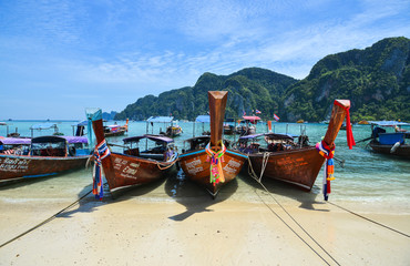Fototapeta na wymiar Traditional wooden boat on blue sea