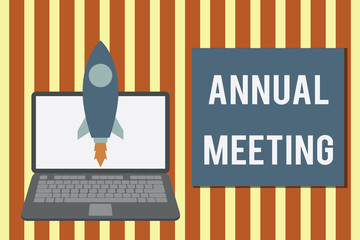 Writing note showing Annual Meeting. Business concept for yearly meeting of the general membership of an organization Launching rocket up laptop Startup Developing goal objective