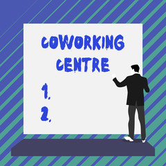 Writing note showing Coworking Centre. Business concept for shared workplace often office and independent activity Short hair immature young man stand in front of rectangle big board