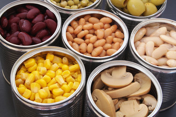 Preserved food on black table close up.