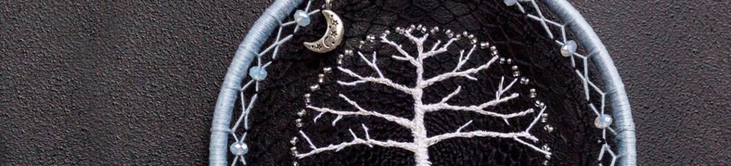 Banner of Handmade dream catcher with feathers threads and beads rope hanging