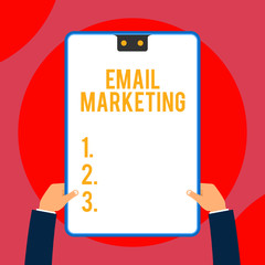 Text sign showing Email Marketing. Business photo text Sending a commercial message to a group of showing using mail Two executive male hands holding electronic device geometrical background
