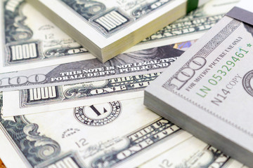 Pack of dollars banknotes and coins background finance economy currency close up selective focus US currency USD