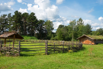 Fototapeta na wymiar Corral for livestock. Fenced off in the center of the tenth place in the Slavic village