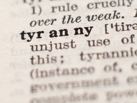Dictionary definition of word tyrany, selective focus.