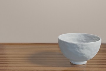 Japanese white rice bowl (empty) on a wood table (corner)