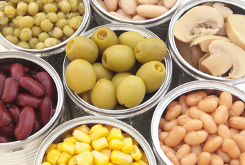 Canned food background, champignons, olives, beans, peas, corn