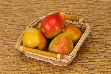 Pear heap in the wooden basket