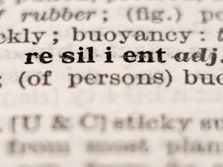 Dictionary definition of word resilient, selective focus.