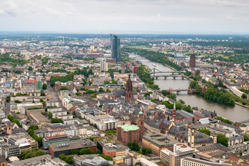 Fototapeta premium FRANKFURT, GERMANY - JUNE 10,2019: view to skyline of Frankfurt from Main Tower on a cloudy day