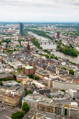 Fototapeta premium FRANKFURT, GERMANY - JUNE 10,2019: view to skyline of Frankfurt from Main Tower on a cloudy day