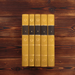 old books on the background of a wooden