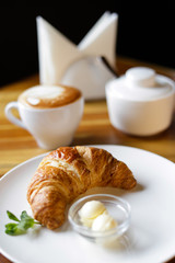 breakfast with coffee and croissant