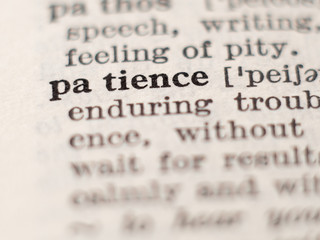 Dictionary definition of word patience, selective focus.