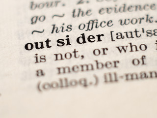 Obraz premium Dictionary definition of word outsider, selective focus.