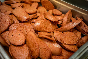 Sausage cut into slices on a tray. A beautiful dish of sausage.
