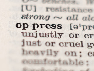 Obraz premium Dictionary definition of word oppress, selective focus.