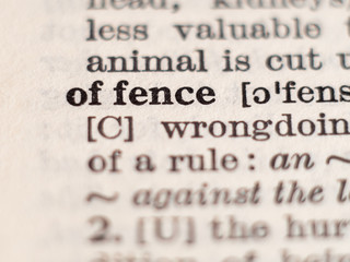 Dictionary definition of word offence, selective focus.