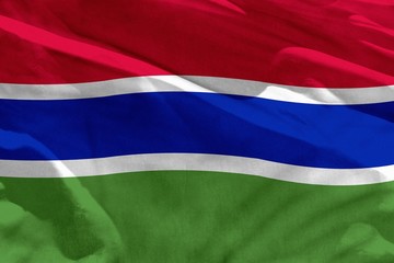 Waving Gambia flag for using as texture or background, the flag is fluttering on the wind