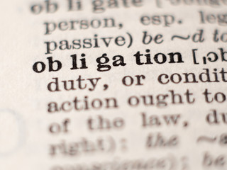 Dictionary definition of word obligation, selective focus.