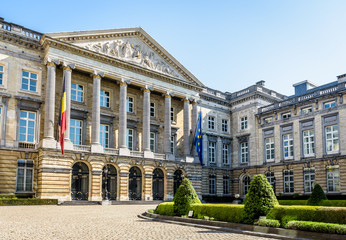 Fototapeta na wymiar Three-quarter front view of the Palace of the Nation in Brussels, Belgium, seat of the Belgian Federal Parliament that shares the legislative power of the federal state with the King of the Belgians.