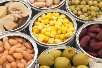 Green peas, beans, corn, olives and mushrooms in tin cans