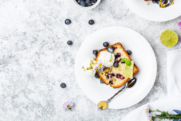 Fototapeta na wymiar Homemade fresh blueberry butter cake with lime