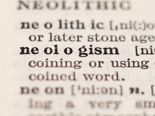 Dictionary definition of word neologism, selective focus.
