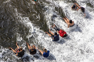 People enjoying a dip in a wawa dam at Rizal Province