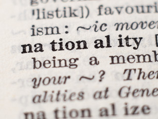 Dictionary definition of word nationality, selective focus.