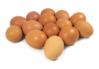 Group of raw Chicken eggs, close-up, top view. Lots of brown eggs.