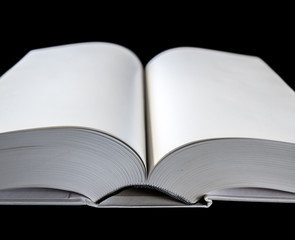 Open blank dictionary, book on black background