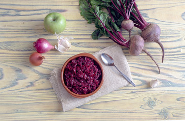 Obraz na płótnie Canvas Fresh, stewed beetroot caviar with spice, onions and an apple